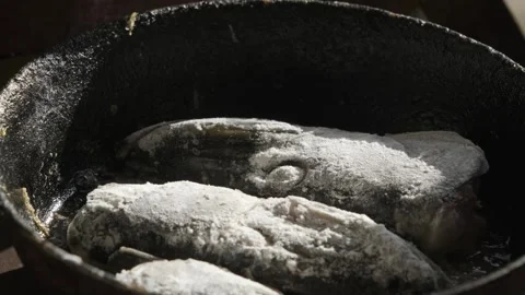 Rustic Fried Fish in Cast-Iron Skillet Stock Footage 303414987