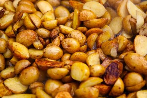 Rustic fried potatoes. Close up background Stock Photos
