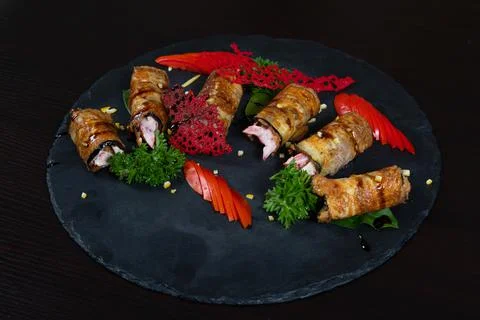 Rustic fried stuffed eggplant with mayo and tomatoes decorated with dill, sli Stock Photos