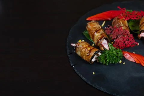 Rustic fried stuffed eggplant with mayo and tomatoes decorated with dill, sli Stock Photos