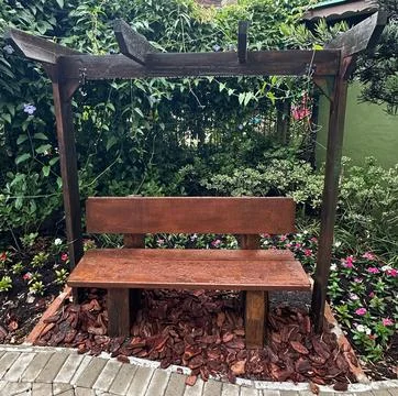 Rustic garden bench with trellis Stock Photos