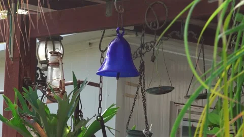 Rustic Garden Decor With Hanging Bell And Vintage Lantern Stock Footage 332058158