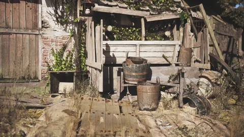 Rustic garden shed with tools and aged wooden elements in a sunny outdoor space 動画素材 326196173