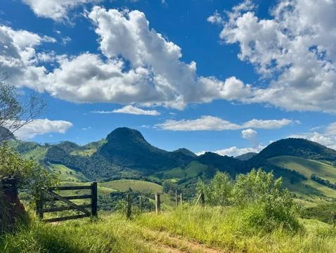 Rustic Gate Opening to Scenic Mountain View Stock Photos