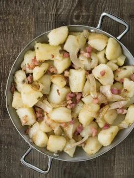 Rustic german pan fried potato bratkartoffeln Stock Photos