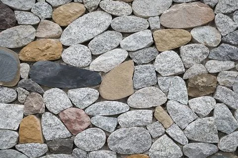 Rustic Granite Stone Wall For Background Stock Photos