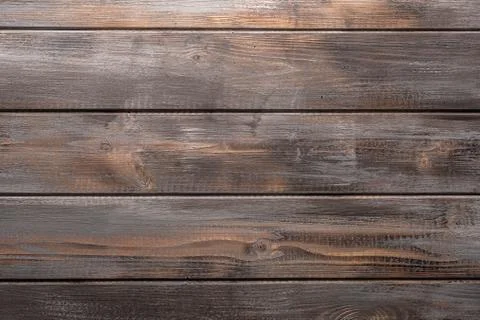 Rustic gray and orange wood background with knots and nail holes Stock Photos
