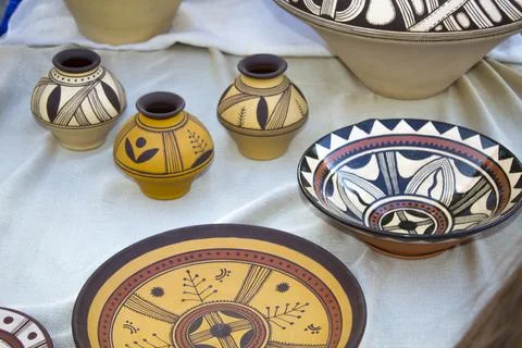 Rustic handmade ceramic clay brown cups souvenirs at street Stock Photos
