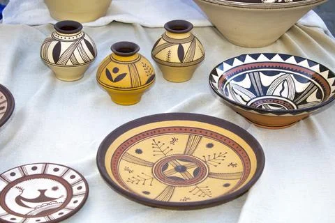 Rustic handmade ceramic clay brown cups souvenirs at street Stock Photos