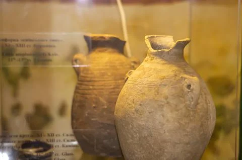 Rustic handmade ceramic clay, brown terracotta jug, souvenirs on display at t Stock Photos