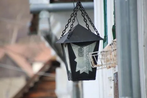 Rustic Hanging Lantern with Weathered Background Captures Countryside Charm Stock Photos