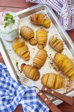 Rustic hasselback potatoes Stock Photos
