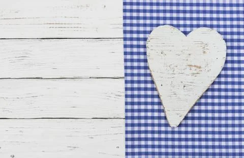 Rustic heart on blue fabric background Stock Photos