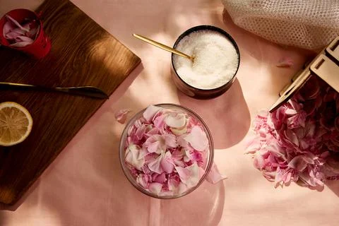 Rustic homemade organic jam preparing with sugar, lemon and tea rose petals Stock Photos