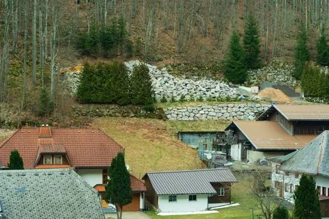 Rustic homes are spread across a serene village as nature awakens in early sp Stock-Fotos