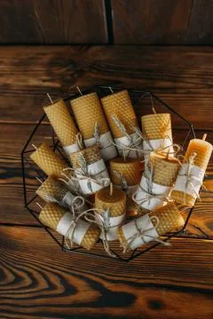 Rustic Honeycomb Candles In A Wire Basket Stock Photos