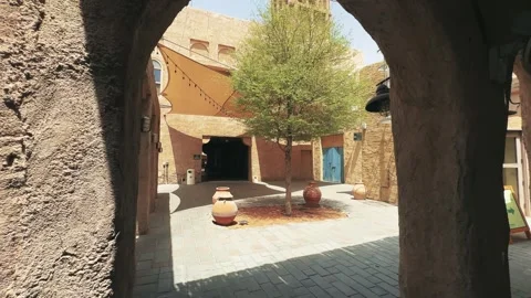 Rustic house courtyard view of old Dubai with traditional architecture and tr Stock Footage 328186063