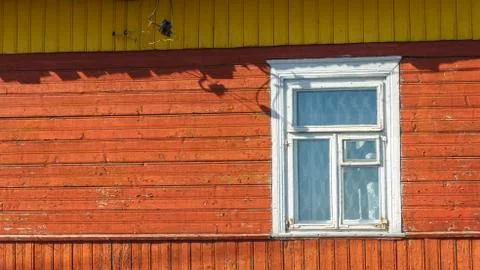 Rustic house wall with window and cracked paint. Space for text. Countryside  Stock Photos