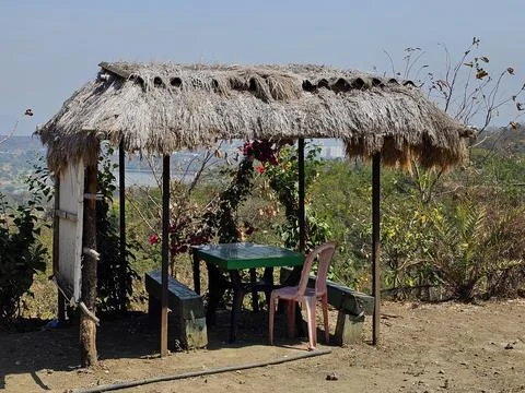 Rustic hut viewpoint A small thatched hut with wooden posts Stock Photos