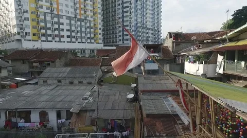 Rustic Indonesia Flag on Settlement Suburban Stock Footage 79948769
