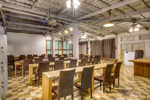 Rustic Interior of a Communal Dining Room with Rustic Gray and Wooden Decor Fotos Stock