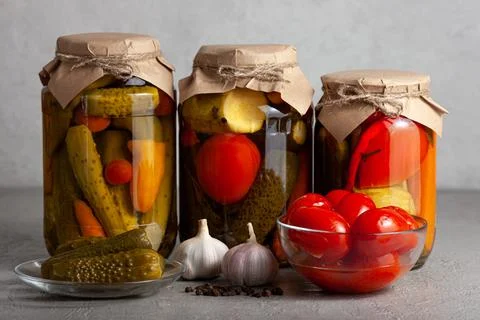 Rustic Jars of Pickled Vegetables with Garlic and Tomatoes Stock Photos