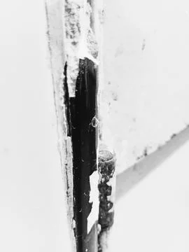 Rustic kitchen door hinge and broken tile background Stock Photos