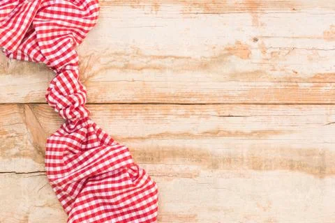 Rustic kitchen table background with red fabric napkin Stock Photos