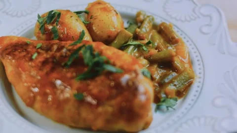 Rustic kitchen technique: overhead beauty shot of chicken and potatoes Stock Footage 342180934