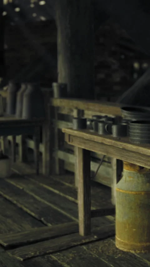 Rustic kitchen with wooden table and milk can near cooking area at night Stock Footage 334167443