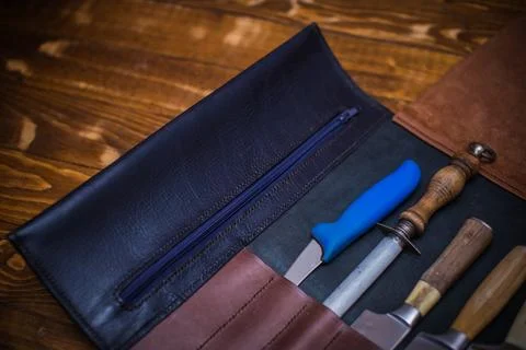 Rustic Knife Set in a Leather Case on a Wooden Surface for Culinary Enthusias Stock Photos