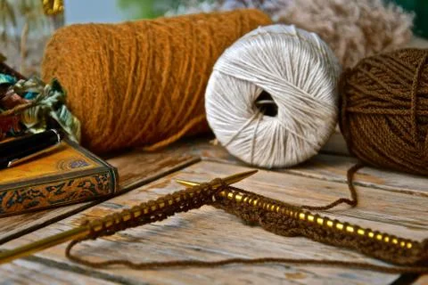 Rustic knitting and threads. Stock Photos