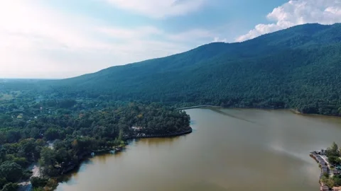 Rustic lakeside shelters and tropical scenery Chiang Mai Thailand aerial view 動画素材 331476510