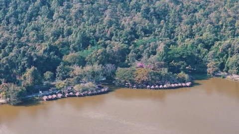 Rustic lakeside shelters and tropical scenery Chiang Mai Thailand aerial view 動画素材 331476519