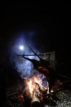 Rustic lamb barbecue bbq over open fire in Chile 스톡 사진