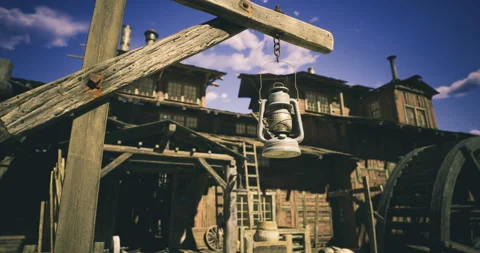 Rustic lantern hanging at an old wooden structure in a deserted town Stock Footage 321780585