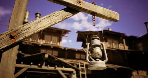 Rustic lantern hanging on a wooden post in an old village setting Illustrazione stock