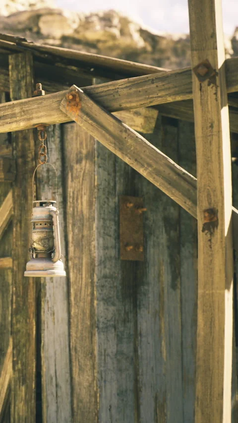 Rustic lantern hung on wooden shack exuding charm and old world magic Stock Footage 341402008