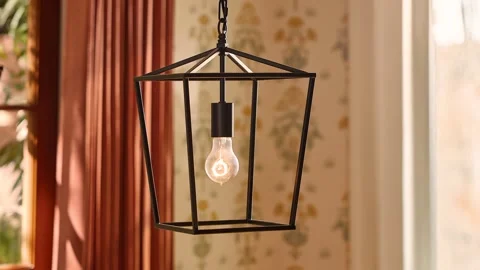 Rustic Lantern Light Fixture Hanging in Sunlit Country Home Interior Stock Footage 340398779