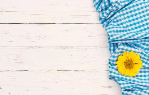 Rustic light blue table cloth and blossom on white wood background Stock Photos