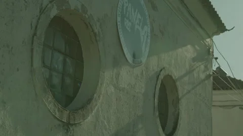 Rustic Lisbon Building with Vintage Circular Window and Sign Stock Footage 273791703