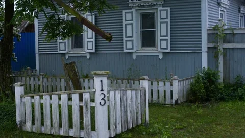 Rustic log house with windows with carved platbands in the background of sk.. Stock Footage 277491823