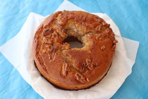 Rustic looking homemade walnut cake on top of white napkin. Delicious, yet plain Stock Photos