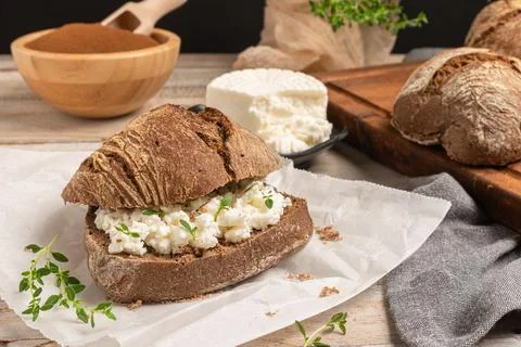 Rustic malt bread with cottage cheese, for breakfast or snack. Selective focu Stock Photos