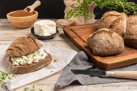 Rustic malt bread with cottage cheese, for breakfast or snack. Selective focu Stock Photos