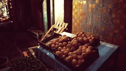 Rustic market corner featuring weathered tiles and stacked produce Stock Footage 335102655