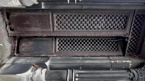 Rustic mausoleum crypts with ornate metal grills. vertical video Stock Footage 330910734