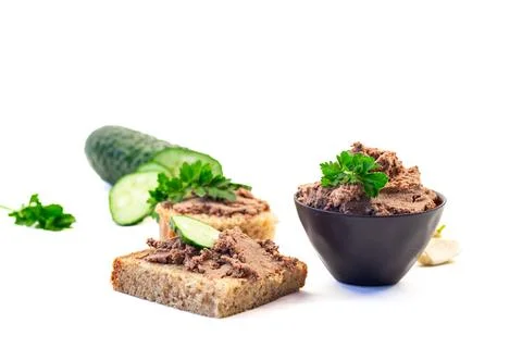 Rustic meat spread with parsley on toasted bread 库存照片