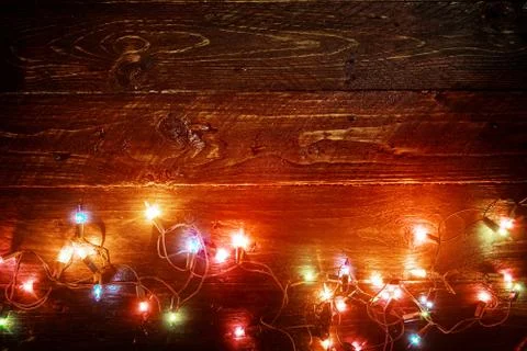 Rustic Merry christmas (xmas) background with plank wood with colorful lights an Stock Photos