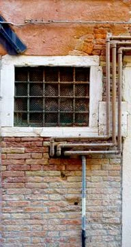 Rustic metal pipe and window Stock Photos